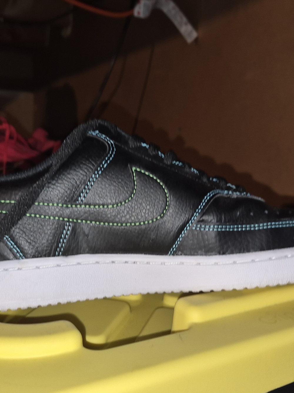 Nike Black Leather Low-Top Sneaker with Blue and Green Stitching